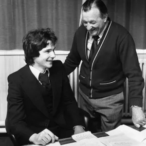 Liverpool manager Bob Paisley looks on as new defender Alan Hansen officially signs for Liverpool manager Bob Paisley looks on as new defender Alan Hansen officially signs for