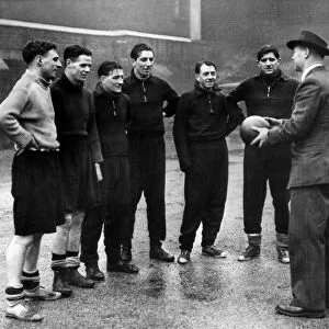Liverpool manager Don Welsh has a final word with some of his Liverpool players in