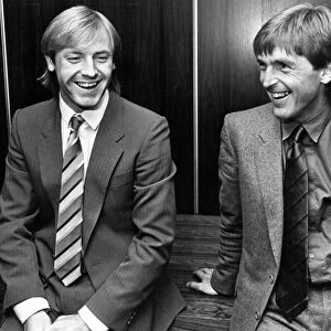 Liverpool manager Kenny Dalglish shares a joke with his new signing Steve McMahon