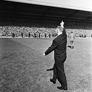Liverpool manager Bill Shankly acknowledges the cheers of the crowd as they celebrate