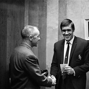 Liverpool manager Bill Shankly gives a farewell handshake to centre forward Tony Hateley