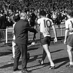 Liverpool manager Bill Shankly goes forward to congratulate the Arsenal players as they Liverpool manager Bill Shankly goes forward to congratulate the Arsenal players as they