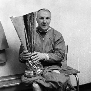 Liverpool manager Bill Shankly holding the UEFA Cup trophy after his side defeated