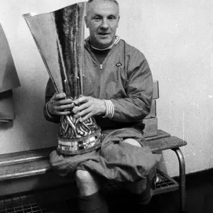 Liverpool manager Bill Shankly holding the UEFA Cup trophy after his side defeated