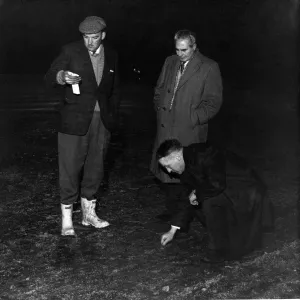 Liverpool manager Bill Shankly inspecting the hardness off the pitch before a match Liverpool manager Bill Shankly inspecting the hardness off the pitch before a match