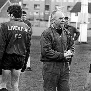 Liverpool manager Bill Shankly speaking with John Toshack during a training session at