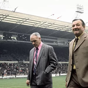 Liverpool manager Bill Shankly walks on to the pitch accompanied by Bob Paisley at