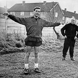 Liverpool manager Bill Shankly watches Gordon Milne going though his tests at Melwood