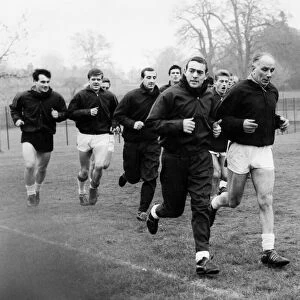 Liverpool players in training led by Reuben Bennett and Ian St John. Circa 1963