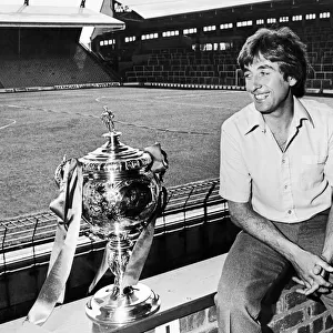 Liverpool Reserve team boss Roy Evans poses beside the Central League Championship trophy