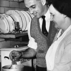 Liverpool full back Ronnie Moran sampling the cooking of his mum in the kitchen at home Liverpool full back Ronnie Moran sampling the cooking of his mum in the kitchen at home