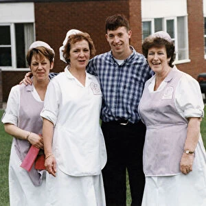 Liverpool striker Robbie Fowler meets up with the dinner ladies at his old school Nugent