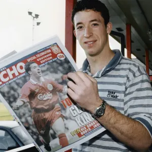 Liverpool striker Robbie Fowler reading the Liverpool Echo Special Celebration Souvenir Liverpool striker Robbie Fowler reading the Liverpool Echo Special Celebration Souvenir