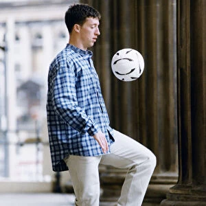 Liverpool striker Robbie Fowler showing off his ball skills at St Georges Hall