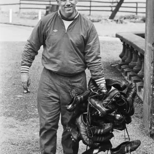 Liverpool trainer Ronnie Moran holding a large collection of player Liverpool trainer Ronnie Moran holding a large collection of player
