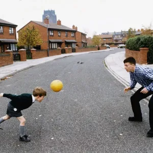 Robbie Fowler Plays with Young Fan in Street, 14th November 1994 Print