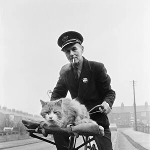 Liverton postman takes his cat on post rounds in Redcar, Cleveland. Circa 1971