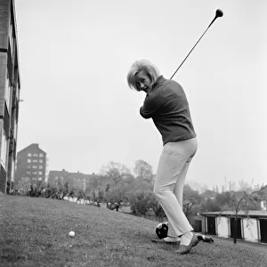 Liz Fraser, English actress, practices her golf swing, April 1967