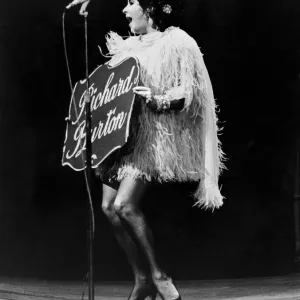 Liz Taylor introduces her husband at a charity show in Paris on the day she became a Liz Taylor introduces her husband at a charity show in Paris on the day she became a
