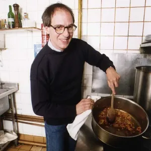 Lloyd Grossman TV Presenter of Master Chef in his own kitchen trying out his own cooking Lloyd Grossman TV Presenter of Master Chef in his own kitchen trying out his own cooking