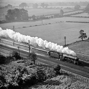 LNER A3 Pacific 2746 Fairway steam locomotive at full speed leaving a trail of smoke as