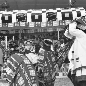 A local chieftain is carried passed Queen Elizabeth II and Prince Philip A local chieftain is carried passed Queen Elizabeth II and Prince Philip