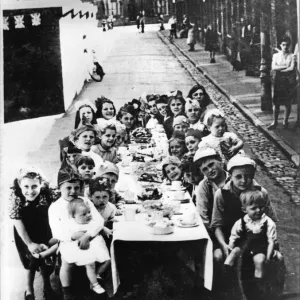 Local children enjoy a VE Day party in Beam Street, Barton Hill, Bristol. 8th May 1945 Local children enjoy a VE Day party in Beam Street, Barton Hill, Bristol. 8th May 1945