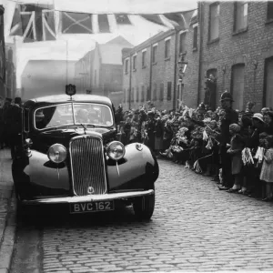 Local children wave their flags and cheer in Craven Street during the visit of the Duke Local children wave their flags and cheer in Craven Street during the visit of the Duke