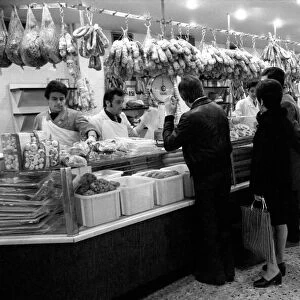 Local people queuing for meat at "Boucherie Bernard"the largest butcher