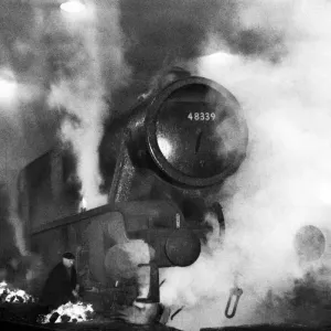 A London Midland & Scottish Railway Class 8F- Stanier locomotive engine being de-iced by