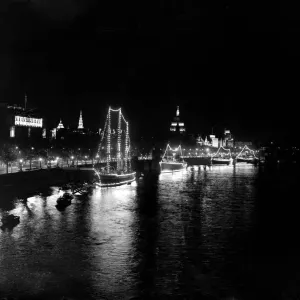 London by night Boats illuminated by night along the River Thames 1951