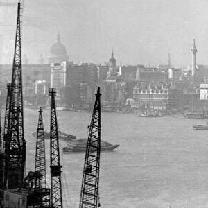 The London Skyline taken from Tower Bridge showing the Pool of London, Wren Churches