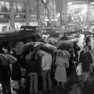 London travellers are soaked by the rain as the end of the 1976 drought is officially