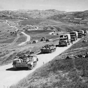 Long columns of vehicles wind over the hills of the Gothic Line