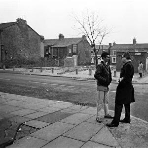 Lord Gifford talks to local resident Delroy Burris in Granby Street, Toxteth