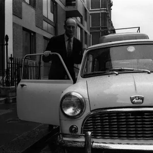 Lord Montagu April 1963 getting into his mini after lunch with Duke of Bedford in Lord Montagu April 1963 getting into his mini after lunch with Duke of Bedford in