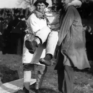 The loser, Ben Hopkins carried away after the contest. His right leg bound with blood The loser, Ben Hopkins carried away after the contest. His right leg bound with blood