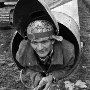 Lou Morris, The Human Pipe Cleaner, 6th November 1969. Lou pushes his 5ft 2in frame along Lou Morris, The Human Pipe Cleaner, 6th November 1969. Lou pushes his 5ft 2in frame along