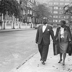 Louis Armstrong seen here arriving for a press conference at the Mayfair Hotel
