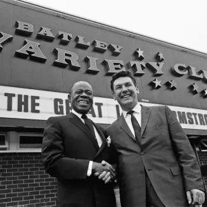 Louis Armstrong seen observing an old Batley tradition. Touching the Yorkshire Mills Louis Armstrong seen observing an old Batley tradition. Touching the Yorkshire Mills