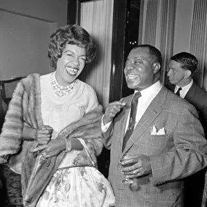 Louis Armstrong with Winifred Atwell during the Daily Mirror lunch for Louis Armstrong at