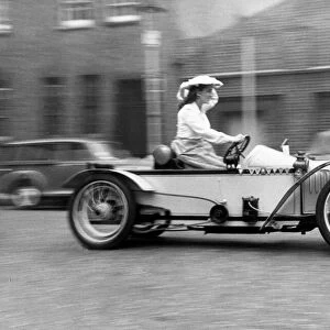 Louise Pomeroy pictured driving a Super two-seater 1910 cycle car outside the Royal