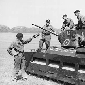 Lt. Peter Gill christens a Matilda tank during Second World War. 5th July 1941