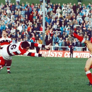 Luc Evans Kicks the Ball in Action Print 1990