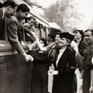 Madame Benes wife of Dr. Benes bids goodbye to the Czech troops before their departure Madame Benes wife of Dr. Benes bids goodbye to the Czech troops before their departure