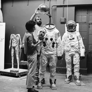Madame Tussauds staff put the finishing touches to waxwork models of astronauts Neil