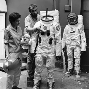 Madame Tussauds staff put the finishing touches to waxwork models of astronauts Neil