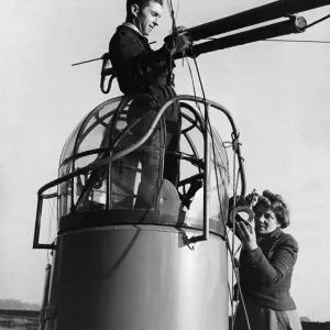 Print of a woman fitting a wireless aerial to a Thorneycroft whaleback boat