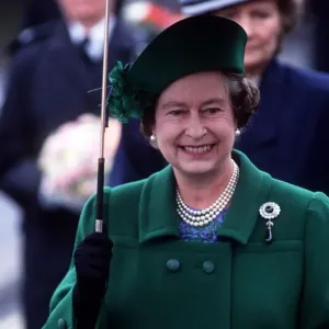 Her Majesty Queen Elizabeth II holds an umbrella during her visit to Torbay to celebrate Her Majesty Queen Elizabeth II holds an umbrella during her visit to Torbay to celebrate