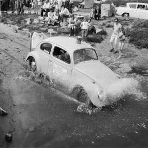 A black and white print of a VW boat with a propeller, partially submerged in water